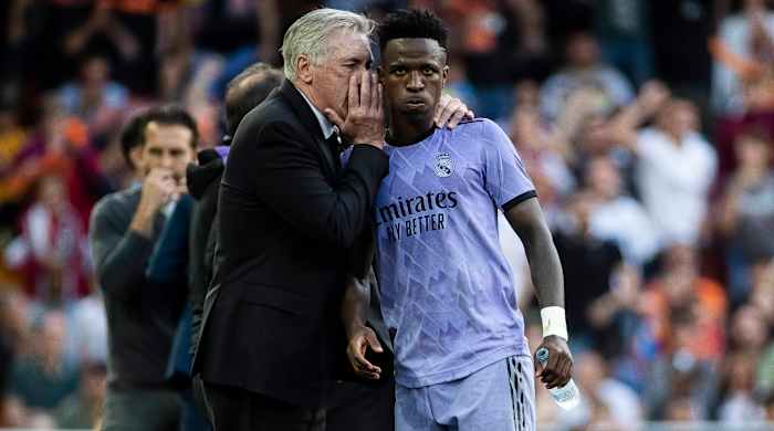 Carlo Ancelotti talking with Vinicius